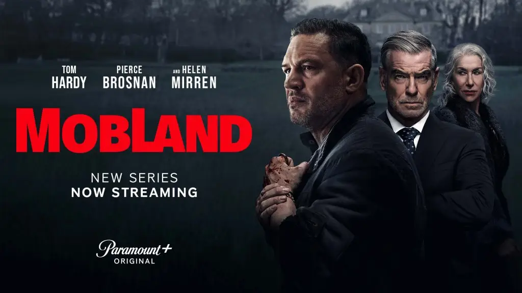 Promotional poster for the Paramount+ original series MobLand, featuring Tom Hardy, Pierce Brosnan, and Helen Mirren standing in a dark, ominous landscape. Tom Hardy holds a bloodied hand, suggesting intense drama and violence.
