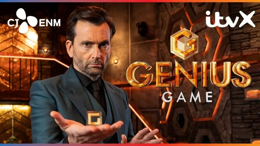David Tennant in a dark suit stares intently while holding a gold cube in front of the Genius Game logo. The background features a futuristic game set with glowing orange and bronze tones. ITVX and CJ ENM logos are visible.